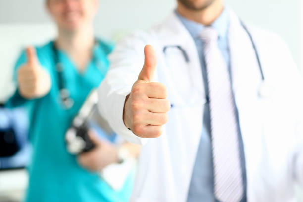 istock Joyful doctors demonstrating ok signs 1177335059