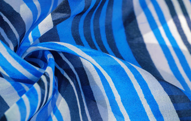 istock Background texture. multicolored striped silk fabric. Mexican coloring theme bright colored striped pattern with abstract stripes 1177335182