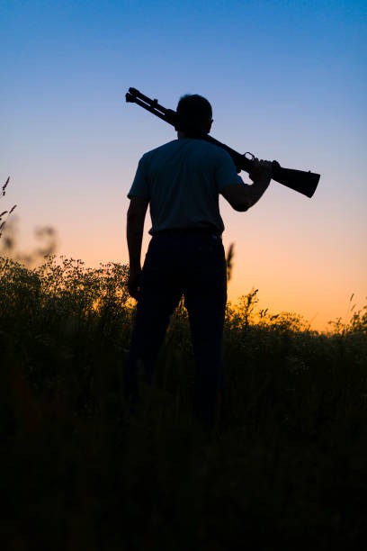 istock Man with rifle early morning 1177336861