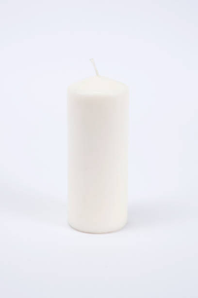 istock White candle on the white isolated background 1177336999