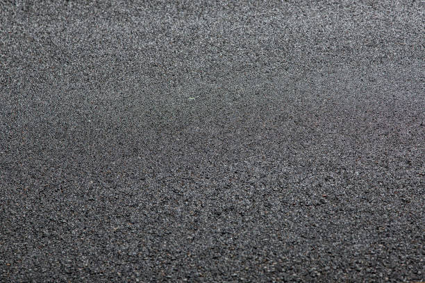 istock tarmac road texture of asphalt road surface with copy space close up. 1177338891