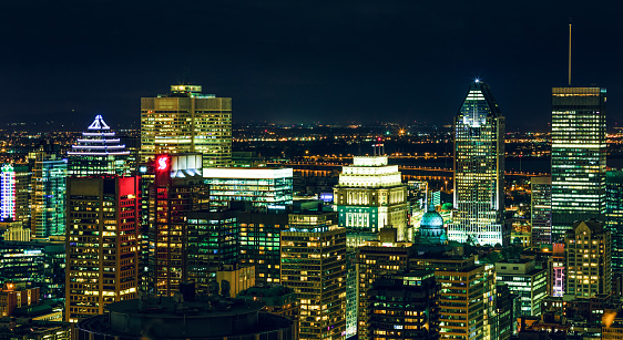 Montreal, Canada - September, 2019. Amazing top view of the Montreal at dusk showing various buildings in the city. Downtown skyscrapers and city skyline at night. Beautiful panorama picture with Canadian city.