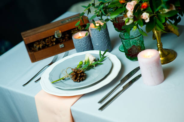 istock turquoise-colored table with gold plates and cutlery. top view 1177341912