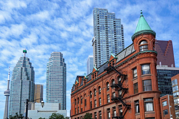 Toronto Financial district skyline in the background with Victorian flatiron building in the foreground. Toronto, Canada - September 20, 2019: Financial district skyline in the background with Victorian flatiron building in the foreground. flatiron building toronto stock pictures, royalty-free photos & images