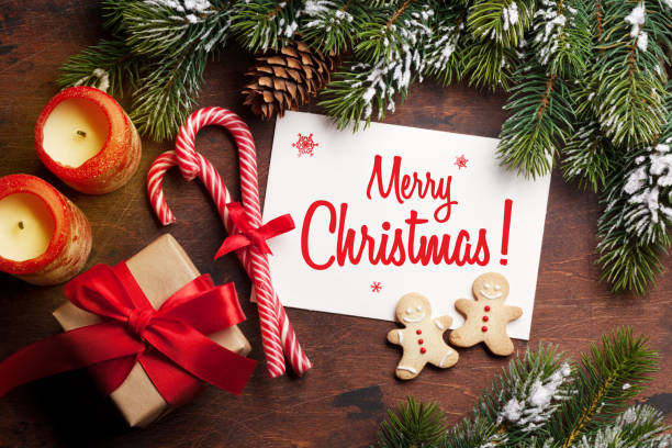 istock Christmas card with gingerbread cookies and fir tree 1177364024