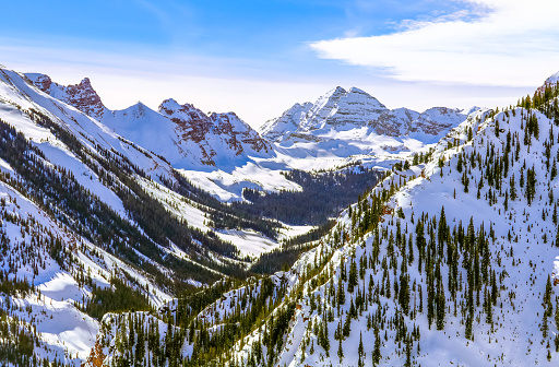 Beautiful view of mountain range in the Maroon Bells Snowmass Wilderness area in winter; Colorado, USA