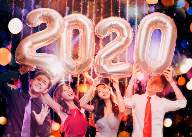 istock happy young group celebrating new year 2020 party 1177366733