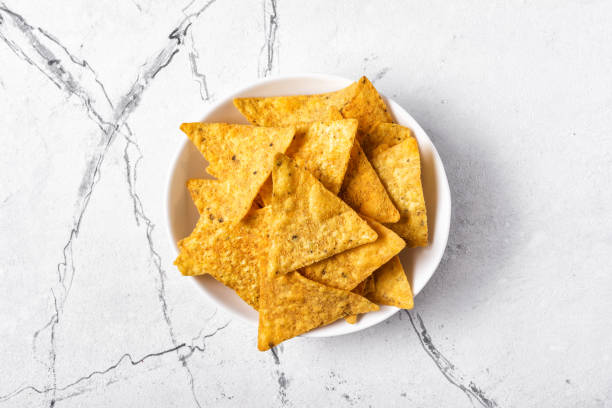 istock Top view of mexican nachos spicy chips in plate 1177366756