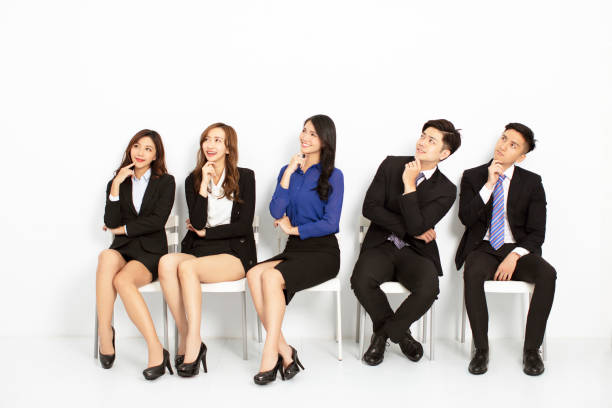 istock asian business people sitting on the chairs in a row 1177366897