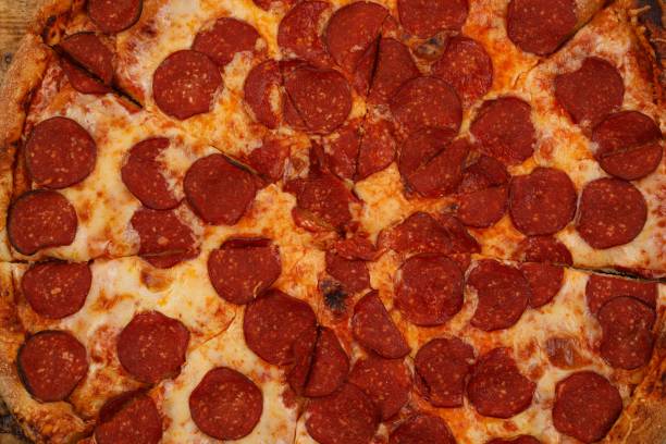 istock Piperoni pizza texture. Background of pizza toppings. 1177368416