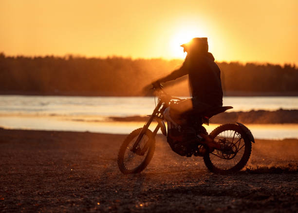 istock Motorcyclist's silhouette on e-motorbike at sunset 1177368963