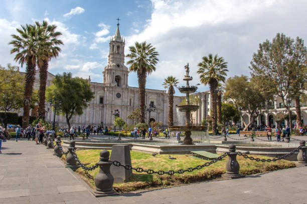 Plaza de Armas and Basilica Cathedral of Arequipa Arequipa / Peru: May 6 2019: Panoramic view of Plaza de Armas and Basilica Cathedral of Arequipa with tourists arequipa province stock pictures, royalty-free photos & images