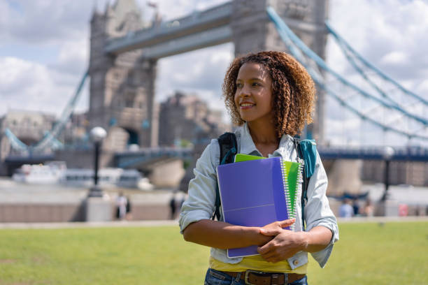 Portrait of an English student studying in London Portrait of a happy English student studying abroad in London and smiling near Tower Bridge exchange student stock pictures, royalty-free photos & images
