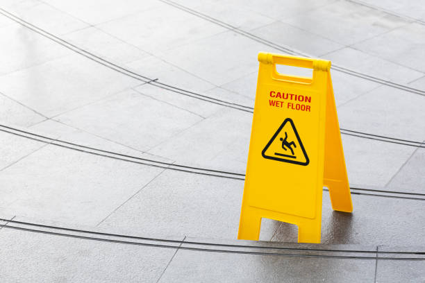 istock yellow slippery warning safety caution sign 1177373090