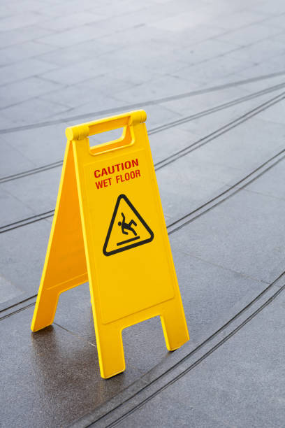 istock yellow slippery warning safety caution sign 1177373308