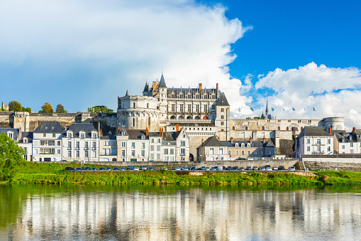 Amboise, France - 1 August, 2019: Beautiful view on the skyline of the historic city of Amboise with renaissance chateau across the river Loire