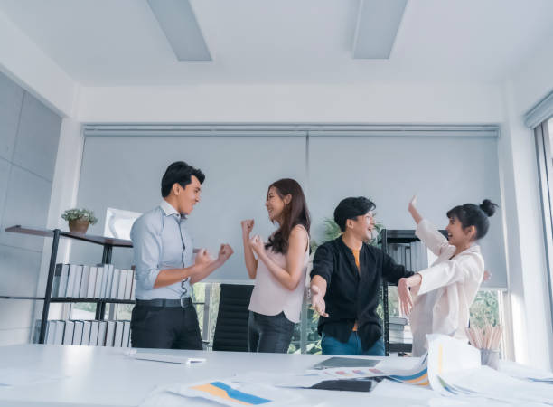 istock joyful excited business people throwing papers 1177378439