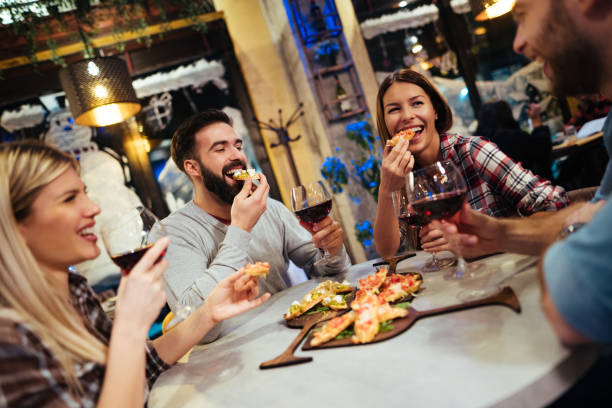 istock Group of friends enjoying red wine in a restaurant 1177378600