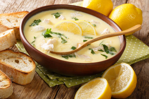 istock Hot greek lemon soup with chicken close-up in a bowl with bread. horizontal 1177380754