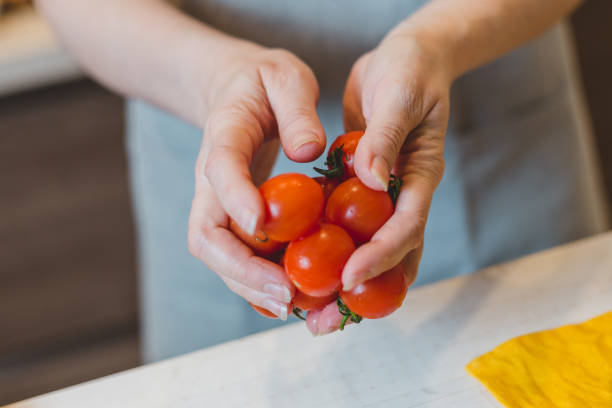 istock The cook chooses the best tomatoes for  exclusive cuisine 1177380948