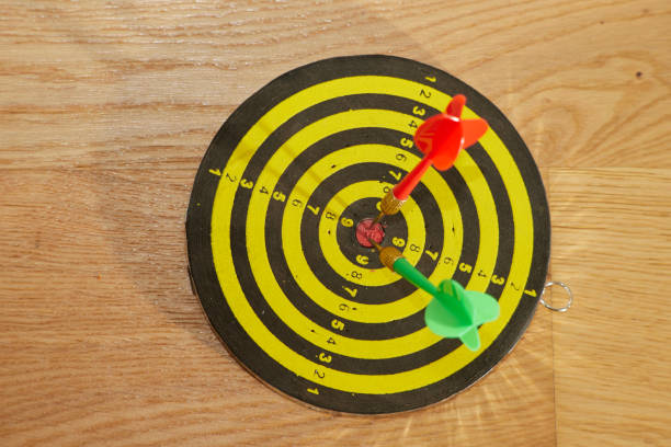 istock two dart arrows exactly in the middle of a target disk 1177382252