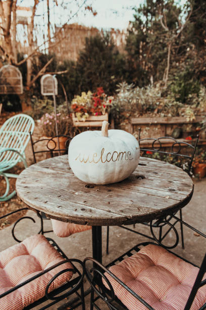istock Pumpkin in a rustic environment, with a word WELCOME written on it 1177382603