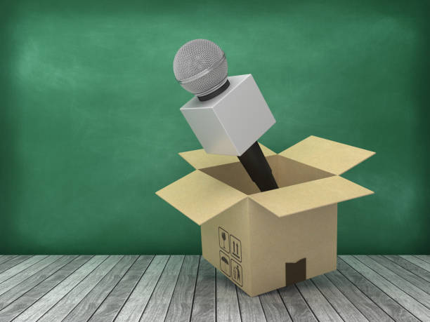 istock Cardboard Box with Microphone on Wood Floor - Chalkboard Background - 3D Rendering 1177382756