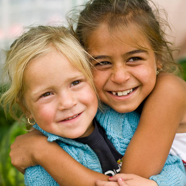istock Two smiling little girls embracing 117738371
