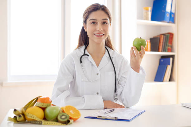istock Female dietician showing 1177386547