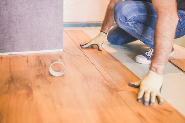 istock The builder is engaged in laying laminate in the room 1177387890