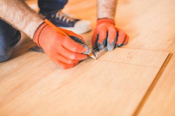 istock Worker measuring and marking laminate for cutting 1177388240