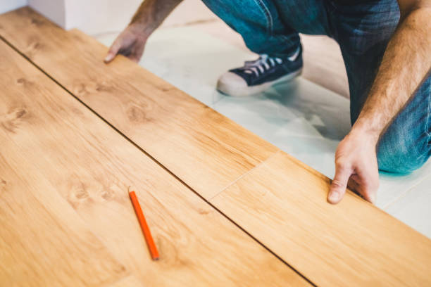 istock Flooring technology - laying of floating laminate floor 1177388571