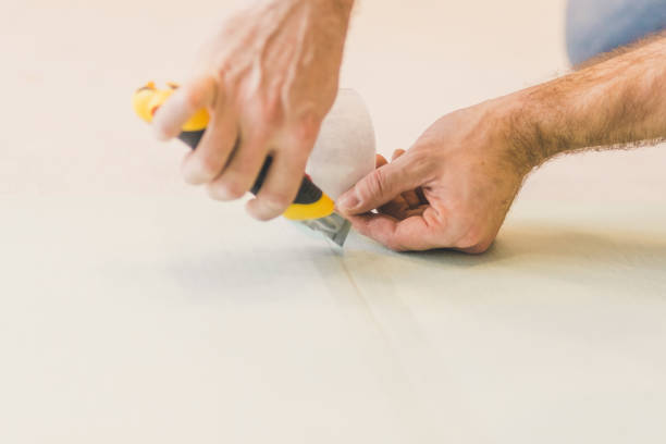 istock European man working at home - laying polystyrene substrate 1177388630
