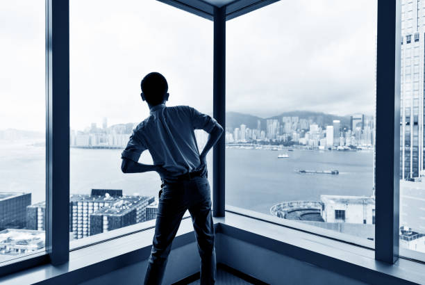 istock Businessman standing by the window and resting 1177388634