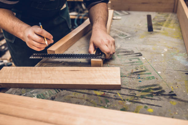 istock Carpentry workshop - master glues furniture panel 1177389198