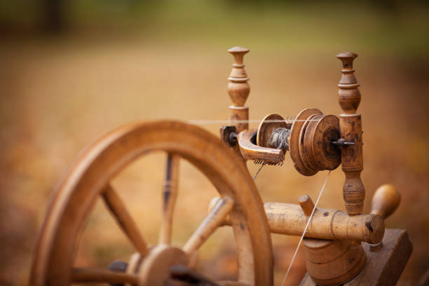 Traditional devices, vintage tailoring equipment concept. Old fashioned wooden distaff, spindle, spinning wheel. Old fashioned wooden distaff. Retro. Vintage. Russia. Belarus. Ukraine