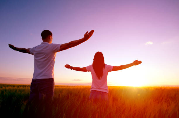 Couple feeling free in a beautiful natural setting.