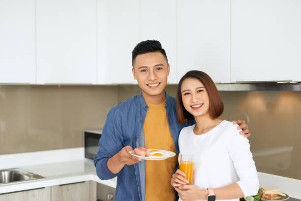 istock Handsome man cooking with his girlfriend at home 1177390569