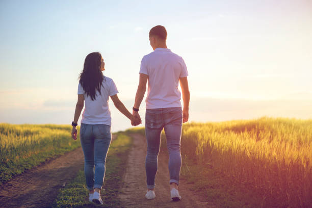 istock Couple Holding Hands Walking Away 1177390580
