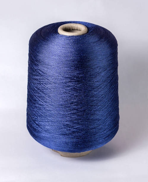 istock bobbin of yarn on a white background. Side view.Textile reel on isolated white background. 1177391649