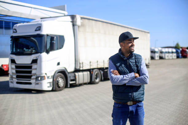 istock Truck driver in front of a warehouse 1177391878
