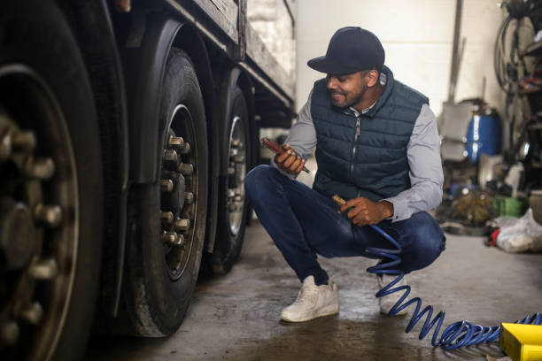 istock Putting air in a truck tire 1177392169