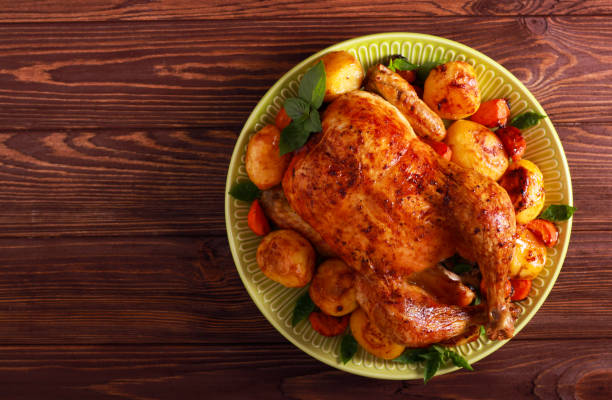 istock Roast whole chicken with vegetavles 1177395117