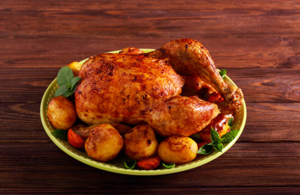 istock Roast whole chicken with vegetables 1177395700