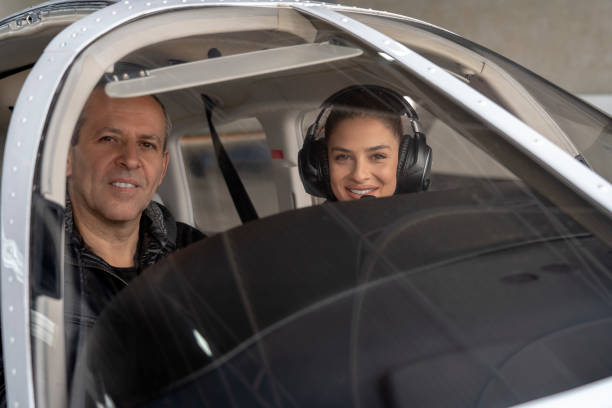 istock Smiling Female Trainee Pilot and Flight Instructor in an Aircraft Cockpit 1177395724