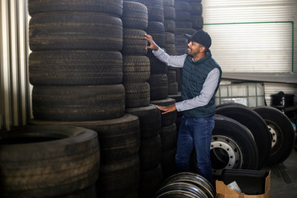 istock Mechanic choosing truck tires 1177397410
