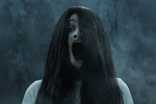 istock Scary ghost woman screaming on dark background 1177400008