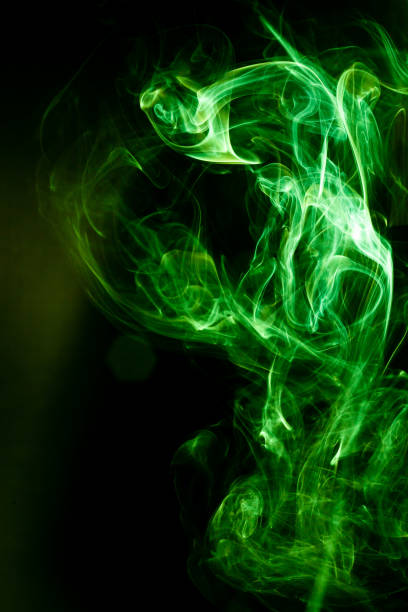 istock Green smoke motion on black background. 1177400029