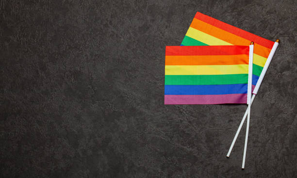 istock LGBT Pride Rainbow Flag. Black background 1177400358