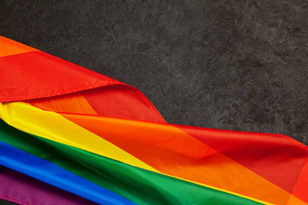 istock LGBT Pride Rainbow Flag. Black background 1177400394